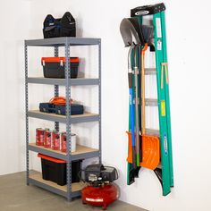 there is a shelf with tools and other items on it next to a fire extinguisher