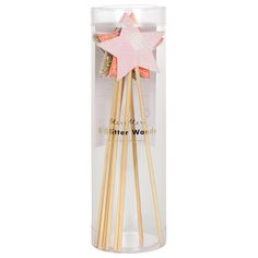 three wooden sticks in a clear box with pink star on top and gold stars on the bottom