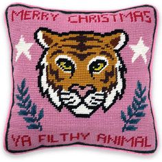 a pink pillow with a tiger on it's face and the words merry christmas ya filthy animal