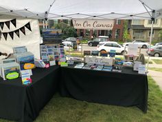 there are many books on display under the tent