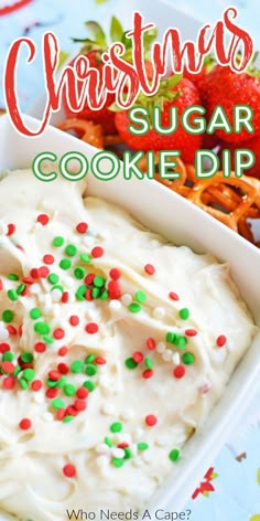 christmas sugar cookie dip with strawberries and pretzels on the side in a white dish