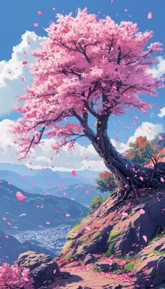 a tree with pink flowers on top of a hill