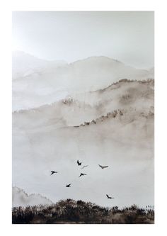 watercolor painting of birds flying in the sky over mountains and foggy hills on a cloudy day