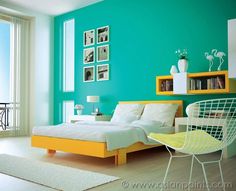 a bedroom with green walls and white carpeted flooring is pictured in this image