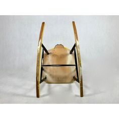 an old fashioned wooden rocking chair with no wheels