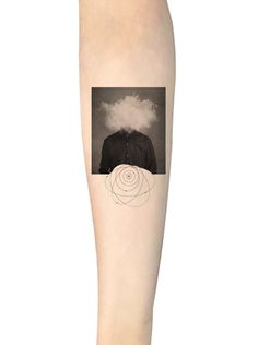 a person's leg with a tattoo on it that has an image of a man in