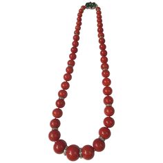 Beautiful natural red coral bead necklace with 12 diamond roundels spacer. Platinum clasp with 5 carved emerald, 1 jadeite and 8 diamonds. Coral beads are ranged from 15.5 mm diameter to 7.35 mm. Total length of necklace is 18.75 inches. Total weight of necklace is 78.8 grams. Red Rondelle Jewelry With Large Beads, Red Coral Single Strand Round Necklace, Red Rondelle Beaded Jewelry, Round Single Strand Red Coral Necklace, Round Red Coral Single Strand Necklace, Hand-strung Round Red Coral Jewelry, Polished Red Coral Bead Necklace, Carved Emerald, Conch Pearl