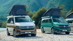 two vans parked next to each other on a gravel road