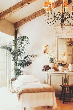 a bedroom with a bed, dresser and mirror in it's centerpieces