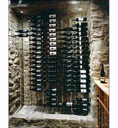 a wine cellar filled with lots of bottles