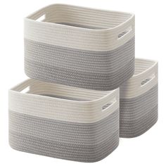 three white storage baskets with handles