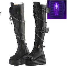 4 1/2" (114mm) Wedge Platform Lace-Up Front Thigh-High Boots 2 Double Grommet Buckle Straps W/ Metal Skull Knockers @ Center And 2 Lower Skull Buckle Straps, Skull Knockers On Outer Heel & Toe, Hanging Chain Detail, Inside Metal Zip Closure, Blacklight Reflective Back Coffin Demonia Women's Us Sizes Brand New Thigh High Goth Boots, Rocker Style Platform Boots For Halloween Concert, Halloween Rocker Platform Boots For Alternative Fashion, Rocker Platform Boots For Halloween, Punk Style Party Wedge Boots With Platform, Rocker Style Platform Boots For Halloween, Punk Style Platform Wedge Boots For Party, Punk Style Platform Boots For Night Out, Gothic Platform Boots With Metal Feet For Halloween