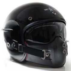 a helmet with goggles is shown on a white surface