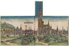 an open book with a drawing of a city in the middle and buildings on both sides