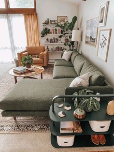 a living room filled with furniture and lots of windows