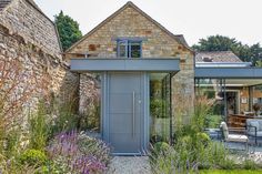 an outside view of a house with stone walls