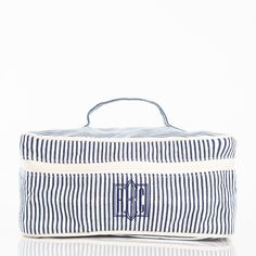 "These canvas striped makeup/jewelry/travel bags are perfect for your next trip.  They measure 5\" H X 11\" W X 8\" L.  They also have a zip closure, a wipeable polyester lining, and an inside zip pocket.   Please leave the following information when placing your order.  - Monogram (first, LAST, middle) or Name  - Monogram font  - Thread color  - Any other special instructions Thank you for shopping Three Threads!  I appreciate your business!"