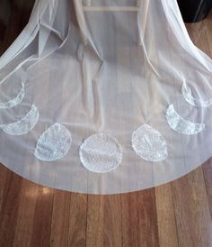 a white veil with five circles on it