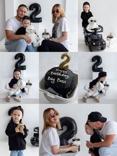 a man and woman holding a baby in front of a cake with the number two on it