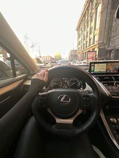 a person driving a car on a city street