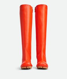 "Find BOTTEGA VENETA Shore Boot on Editorialist. Leather knee-high boot. Lining: Lambskin. Color: New Orange. Oversized rubber-injected outsole. Heel: 7 cm | 3.9\". Shaft: 38 cm | 25.2\", based on a size 38 (IT). Lambskin." Bottega Boots Outfit, Fall Business Casual Outfits, Orange Boots, Business Casual Fall, Knee High Leather Boots, Business Casual Outfits, Boots Outfit, Knee High Boots, Bottega Veneta