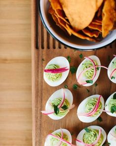 small deviled eggs with guacamole and tortilla chips