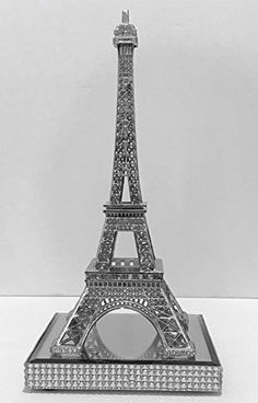 the eiffel tower is shown in this black and white photo, with crystal stones