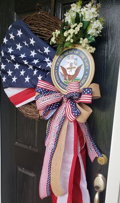 a wreath with an american flag and the seal of the united states is hanging on a door