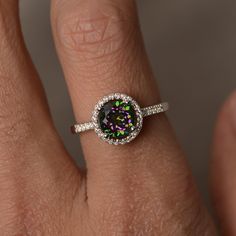 This is a gorgeous handmade creation. Its beauty is its simplicity & Elegance. The 7mm round cut mystic topaz is crafted in solid sterling silver and with rhodium plated. All item is sent in a beautiful gift box You can realize more lovely stuff clicking the link https://www.etsy.com/shop/knightjewelry?refshopsection_shophome_leftnav Please leave the correct address and you phone number for delivering successfully. White Topaz Round Birthstone Ring, Cubic Zirconia Halo Birthstone Ring, Topaz Jewelry With Halo Setting, Halo Cubic Zirconia Birthstone Ring, Round Topaz Halo Jewelry, Iridescent Sterling Silver Promise Ring, Dazzling Topaz Ring With Halo Setting, Iridescent Fine Jewelry Ring For Anniversary, Silver Topaz Ring With Halo In Sterling Silver