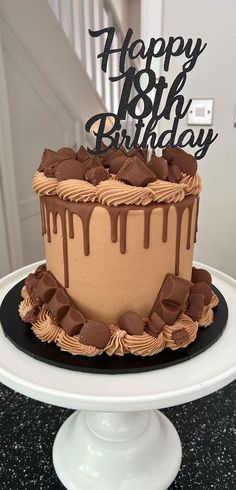 a birthday cake with chocolate icing on top