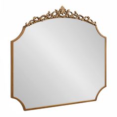 an ornate gold framed mirror on a white background