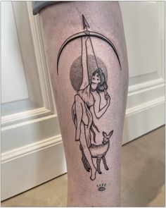 a woman holding an umbrella over her head with a cat on it's leg