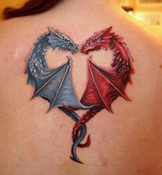 the back of a woman's shoulder with two colorful dragon tattoos on her chest