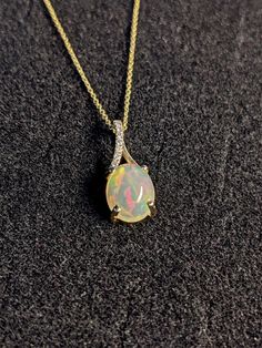 Pendants-Ethiopian Opal Pendant W All Natural Diamond Accents in 14k Solid Gold | Oval Shape | Jelly Opal | October Birthstone | Customizable - NNJGemstones Jelly Opal, Jewelry Appraisal, Solitaire Studs, Birthstone Gifts, October Birthstone, Custom Jewelry Design, Natural Earth, Opal Pendants, October Birth Stone