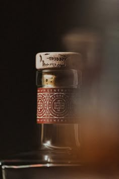 a glass jar with some writing on it