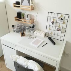 a white desk with various items on it