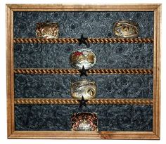 an old wooden frame with glass bowls on it