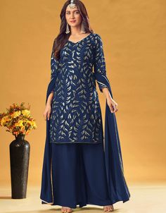 Navy Blue Pure Fox Georgette Palazzo Suit Navy Blue Embroidery Work:Arabic Attire #indiansuitdesigns #salwarkameezboutiques #latestsuitdesign #salwarsdesign #suitingindia #fashionsuitforladies #selwardesigns #salwarsdesigns #womensprintedsuits #onlinesalwarkameez #designerdressessuit #suitdressdesign #designerdresssuits #shlwardesign #cheapsalwarkameez #womensuitsstyles #indiankameez #printedwomenssuit #blackshalwarkameezwomen #ladiesindiansuits Salwar Suits Party Wear, Palazzo Suit, Georgette Tops, Royal Blue And Gold, Designer Salwar Suits, Stylish Sarees, Dress Stores Online, Anarkali Dress