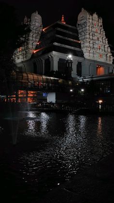 a large building sitting on top of a body of water