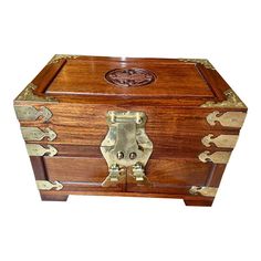 an antique wooden chest with brass accents