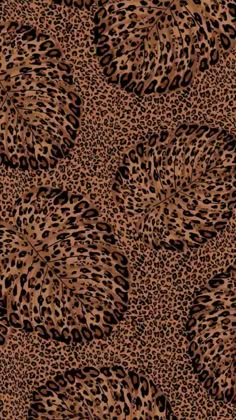 an animal print pattern with many spots on it's surface, in brown and black