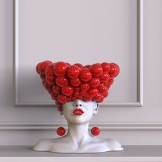 a white mannequin head with red balloons on it's head in front of a fawna art sign