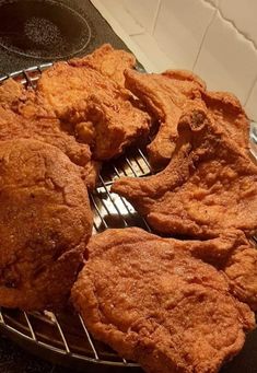 some fried food sitting on top of a metal rack