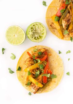 two tacos with chicken, peppers and cilantro