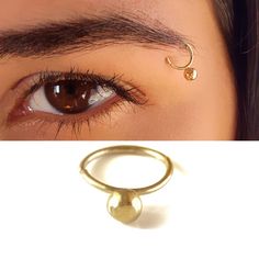 Unique Tribal Eyebrow Ball Piercing Ring, a Boho-Hippie Eyebrow Ring made of 14k Solid Gold, Unisex Indian Piercing Jewelry, Statement Jewelry for Women and Men Ramp up your fashion statement factor and get yourself unique eyebrow-piercing jewelry! This unique eyebrow-piercing ring is sure to make a statement made of the finest 14k solid gold. Intended to highlight pretty features in your appearance or to add a cool edge to your style, it also fits different Piercing Locations: nose ring, Septum Eyebrow Piercing Ring, Indian Piercing, Piercing Locations, Pretty Features, Eyebrow Piercing Jewelry, Eyebrow Jewelry, Eyebrow Ring, Eyebrow Piercing, Piercing Ring