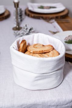 some cookies are in a white bowl on a table