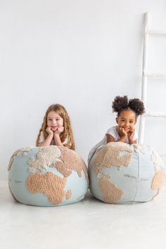 Round pouffe simulating the planet Earth, with the continents tufted in soft rug pile in natural, beige and linen colors on top of a light blue canvas base. Names of oceans and continents in grey embroidery. Finished with a zipper, which allows to remove the filler. The filler is made of a mix of fibre from recycled PET-bottles, and light-weight polystyrene pearls. Product Overview Color: Light Blue,Natural,Linen,Beige,Grey Composition: Cover: 97 % cotton 3 % other fibre Filler: a mix of fibre f Traveler Room, Play Cafe, Kids Globe, Childcare Business, Girls Playroom, Earth Globe, 3 Boys, East River