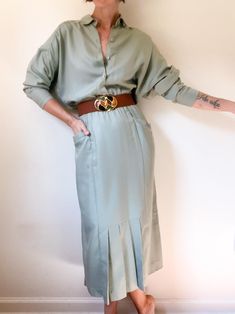 90s vintage sage dolman sleeve dress / wide relaxed button up top / pencil bottom with pleats at front / angled pockets / elastic waist / rayon blend / made by Meridian ⚡️ labeled size 4 (modeled on size small, 5'5") ⚡️ measured lying flat: shoulders 24" pit to pit 22" waist 10"-16" hips 18" length 51" sleeve length 17.5" ⚡️missing original belt (belt pictured also for sale), two very small marks on left chest (pictured) ------------------------------------------------------------------------------------------- Please message questions prior to purchase. Once shipped, sales are final, no return/exchange. But please contact me if you have any problems with your order. Please see FAQs for more information on shop policies. Thanks! Dolman Sleeve Dress, Button Up Top, 90s Vintage, Dolman Sleeve, Dress Clothes For Women, Label Sizes, Waist Size, Sleeve Dress, Elastic Waist