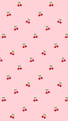 a pink background with cherries on it