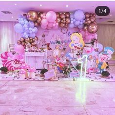 an image of a birthday party setting with balloons and princesses on the wall for decoration